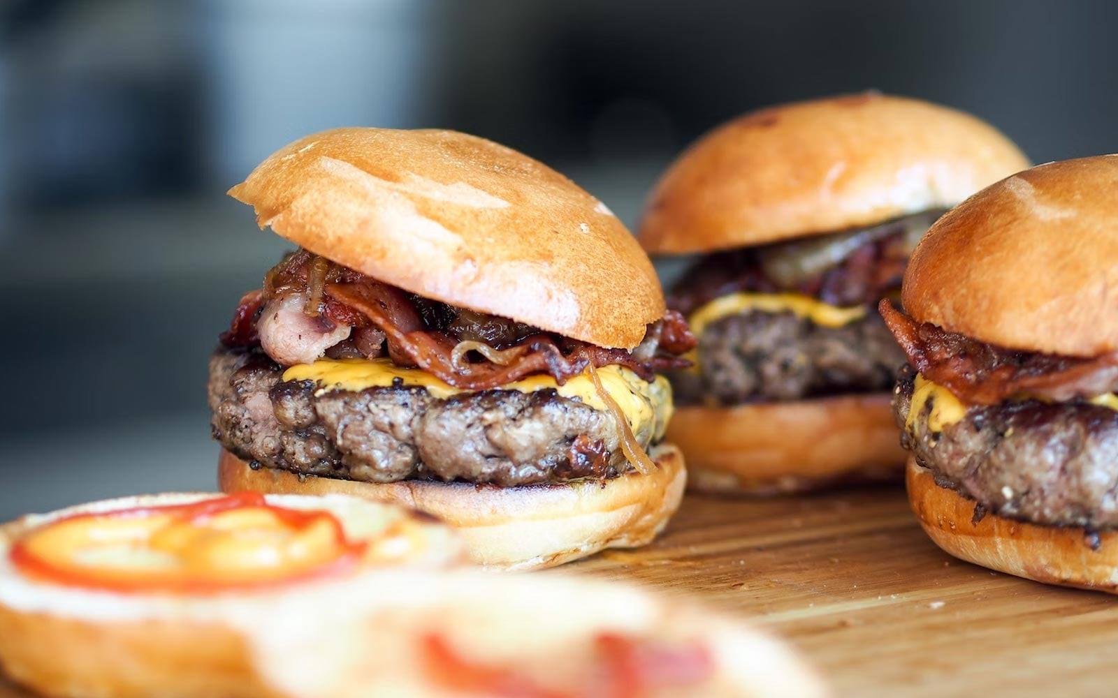 Sliders with bacon and cheese on brioche buns
