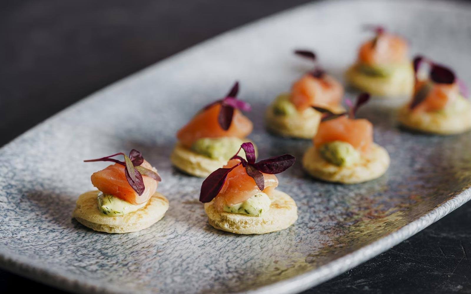 Smoked salmon bites on a serving platter