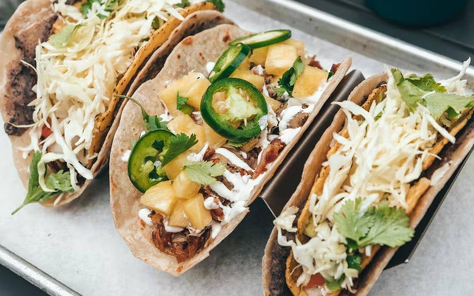 Tacos with slaw, jalapeños and cilantro